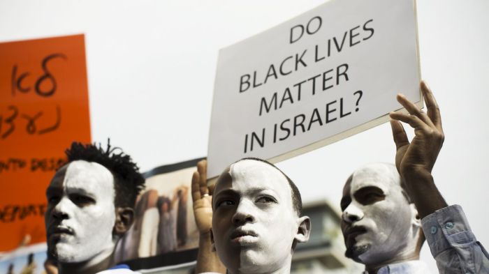 black israeli's protest after israel announces deportation